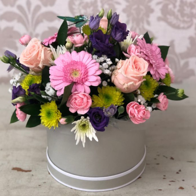 Hat Box of Dreams - A gentle arrangement of pastel-coloured blooms in a stylish box, perfect for expressing delicate sentiments.