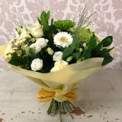 Spring Meadow - A fresh and cheerful bouquet with a mix of bright yellow and white flowers, perfect for bringing a touch of spring indoors.