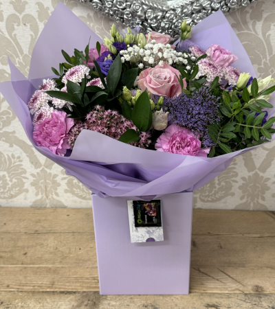 Lilac Boxed Hand Tied - A lilac and green hand tied boxed bouquet, perfect for that special occasion.