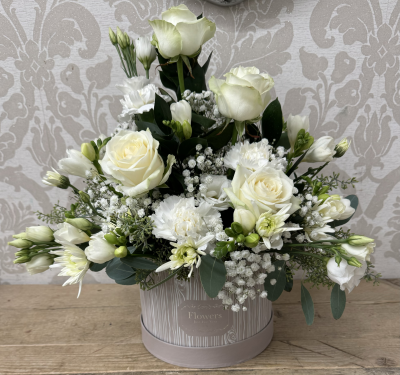 Winter Hat Box - A beautiful arrangement of whites, creams and green, perfect for any occasion.