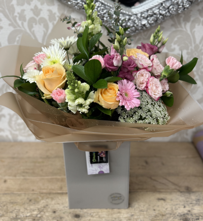 Peachy Hand Tied - A mix of peach, pink and cream fresh flowers, suitable for any occasion.